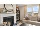 Cozy living room featuring a fireplace, hardwood floors, and neutral decor, creating a comfortable and stylish space at 1739 Goodwin, Hampton, GA 30228