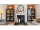 Charming living room with decorative fireplace, hardwood flooring and contemporary display cabinets at 1739 Goodwin, Hampton, GA 30228