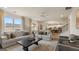Bright, open-concept living room featuring hardwood floors, large windows, and comfortable, modern furniture at 1739 Goodwin, Hampton, GA 30228