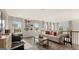 Bright living room boasts wood floors, a cozy seating area, and sports-themed decor at 1739 Goodwin, Hampton, GA 30228