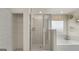 A luxurious main bathroom featuring a soaking tub, a glass shower and large walk-in closet at 1739 Goodwin, Hampton, GA 30228