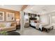 Inviting main bedroom offers soft lighting, neutral paint, a ceiling fan, a sitting area, and multiple windows at 1739 Goodwin, Hampton, GA 30228