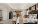 A main bedroom features a fireplace, a sitting area, an oversized bed and neutral tones at 1739 Goodwin, Hampton, GA 30228