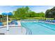 Community pool with lounge chairs surrounded by lush landscaping at 1739 Goodwin, Hampton, GA 30228