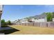 Lush green backyard with wooden fence, offering privacy and room for outdoor entertaining at 2805 Topaz Rd, Riverdale, GA 30296
