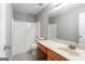 Bathroom with wood vanity, tile floor, and a combined tub and shower unit at 2805 Topaz Rd, Riverdale, GA 30296