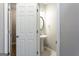 Half-bath with pedestal sink and neutral color palette at 2805 Topaz Rd, Riverdale, GA 30296