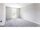 Bedroom featuring plush carpeting, neutral walls, and a window that provides natural light at 2805 Topaz Rd, Riverdale, GA 30296
