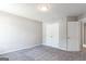 Bedroom featuring neutral walls, plush carpeting, and a spacious closet with double doors at 2805 Topaz Rd, Riverdale, GA 30296