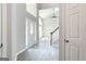Bright foyer featuring soaring ceilings and hardwood floors, with a glimpse into the living spaces at 2805 Topaz Rd, Riverdale, GA 30296