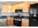 Well-equipped kitchen with stainless steel appliances and light wood cabinetry at 2805 Topaz Rd, Riverdale, GA 30296