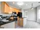 Well-lit kitchen featuring an island and modern appliances with views to living spaces at 2805 Topaz Rd, Riverdale, GA 30296