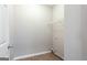 Laundry room with tile floor and wire shelf at 2805 Topaz Rd, Riverdale, GA 30296