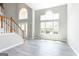 Spacious living room with large windows and a vaulted ceiling, offering plenty of natural light at 2805 Topaz Rd, Riverdale, GA 30296