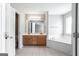 Main bathroom with dual vanity, soaking tub, and separate toilet at 2805 Topaz Rd, Riverdale, GA 30296