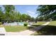 Community pool surrounded by lush trees and greenery, perfect for relaxing summer days at 2805 Topaz Rd, Riverdale, GA 30296