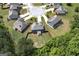 Bird's-eye view of the cul-de-sac homes with fenced backyard and mature trees behind the property line at 5016 Brass Ct # 195, Locust Grove, GA 30248