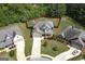 This beautiful aerial view of the house shows a long driveway, lush backyard and beautiful landscaping at 5016 Brass Ct # 195, Locust Grove, GA 30248