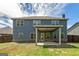 Covered patio with great view of the large backyard, perfect for relaxation at 5016 Brass Ct # 195, Locust Grove, GA 30248