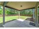 Outdoor covered patio with a concrete floor and view to backyard and privacy fence at 5016 Brass Ct # 195, Locust Grove, GA 30248