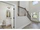 View of entry and staircase plus half bathroom with granite vanity at 5016 Brass Ct # 195, Locust Grove, GA 30248