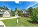 Spacious home with a large front yard and long driveway, surrounded by mature trees at 5016 Brass Ct # 195, Locust Grove, GA 30248