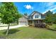 Charming two-story home with brick and siding, a well-maintained lawn, and an attached two-car garage at 5016 Brass Ct # 195, Locust Grove, GA 30248