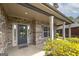Inviting brick home with a covered front porch and blue door at 5016 Brass Ct # 195, Locust Grove, GA 30248