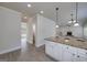 Kitchen island with granite countertops and view into living space at 5016 Brass Ct # 195, Locust Grove, GA 30248