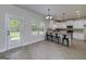 Kitchen dining area featuring barstool seating and an adjacent door leading to the backyard at 5016 Brass Ct # 195, Locust Grove, GA 30248