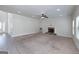 Inviting living room showcasing a fireplace, neutral walls, a ceiling fan, and carpet flooring at 5016 Brass Ct # 195, Locust Grove, GA 30248
