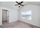 Bedroom featuring a ceiling fan, closet, and large window at 5016 Brass Ct, Locust Grove, GA 30248