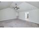 Large bonus room with neutral carpet, a ceiling fan, and great natural light at 5016 Brass Ct, Locust Grove, GA 30248