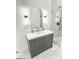 Bathroom features a vanity with gold fixtures, modern mirror, and a glass shower at 3180 Lee Dr, Buford, GA 30518