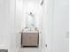 A well-lit bathroom with a vanity and ample lighting with a modern design at 3180 Lee Dr, Buford, GA 30518