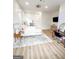 Bright bedroom with hardwood floors, vanity, plush bedding, and lots of natural light at 3180 Lee Dr, Buford, GA 30518