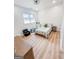 Bright bedroom with hardwood floors, featuring a full size bed, chair, and dresser at 3180 Lee Dr, Buford, GA 30518