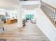 Bright and airy foyer featuring an open floor plan with hardwood floors and staircase at 3180 Lee Dr, Buford, GA 30518