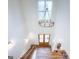 Bright foyer with hardwood floors, chandelier, and staircase at 3180 Lee Dr, Buford, GA 30518