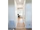 Hallway leading to office with desk and natural light from window at 3180 Lee Dr, Buford, GA 30518