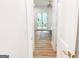 Bright hallway leads to main bedroom with French doors opening to balcony at 3180 Lee Dr, Buford, GA 30518