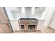 Modern kitchen featuring a stainless steel range, white cabinets, and stone backsplash at 3180 Lee Dr, Buford, GA 30518