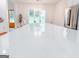 Bright kitchen with a large quartz island and stainless steel appliances overlooking the backyard at 3180 Lee Dr, Buford, GA 30518