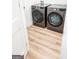 Laundry room with side-by-side washer and dryer set on tile floor at 3180 Lee Dr, Buford, GA 30518
