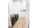 Laundry room with side-by-side washer and dryer and built-in cabinets at 3180 Lee Dr, Buford, GA 30518