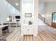 Hallway off of the living area with white cabinets and wooden staircase at 3180 Lee Dr, Buford, GA 30518