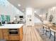 Open living space with wood floors and built-in shelving by fireplace at 3180 Lee Dr, Buford, GA 30518