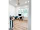 Bright office space with built-in desk, wood floors, and natural light from the window at 3180 Lee Dr, Buford, GA 30518