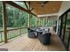 Inviting outdoor porch with seating area and fire pit, perfect for relaxing and entertaining at 3180 Lee Dr, Buford, GA 30518