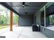 Covered back porch offers a shady respite, complete with a ceiling fan and view of the green yard at 227 Wet Wood Ct, Fairburn, GA 30213